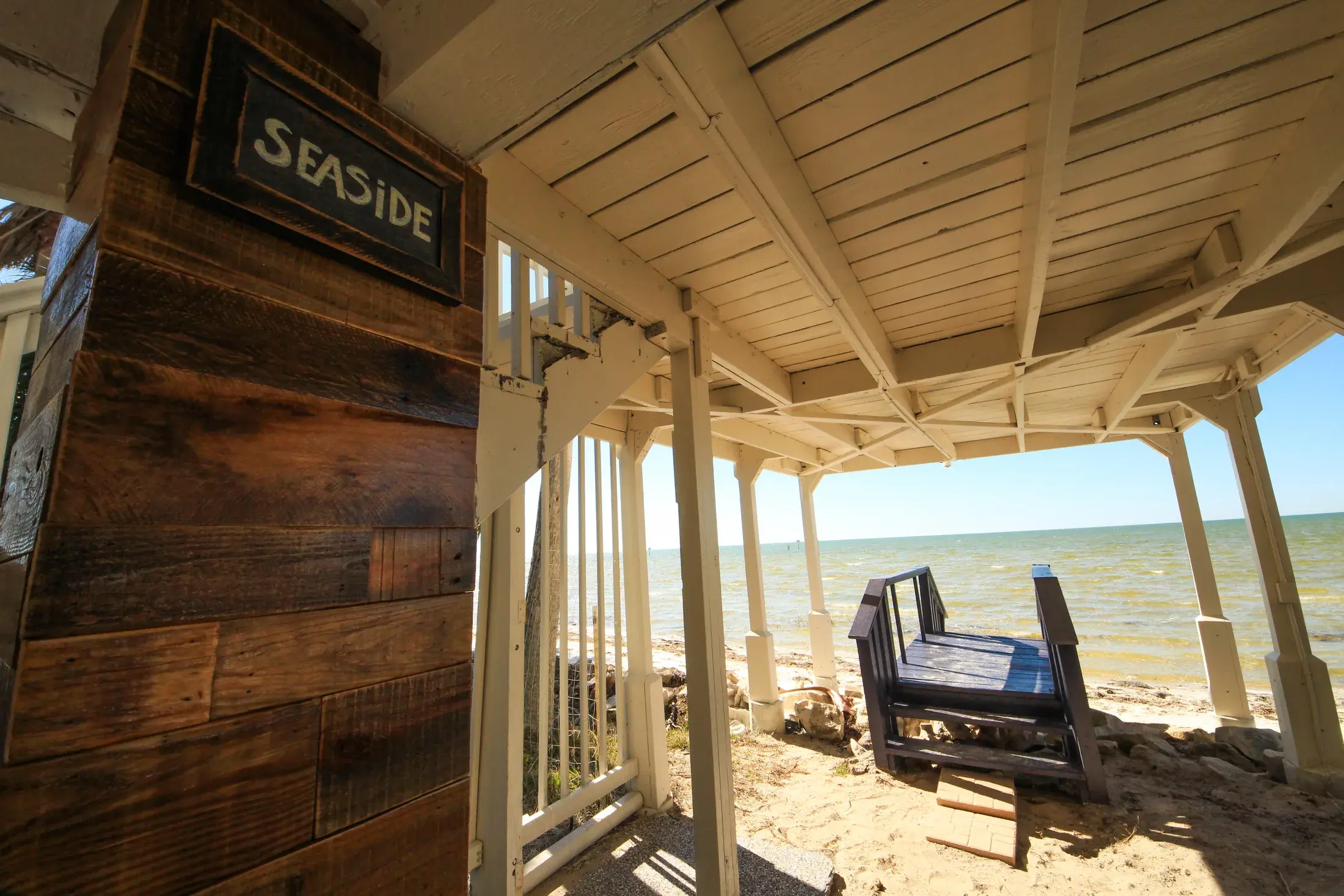 Private beach access path and lower deck area at Come Sail Away Suite.